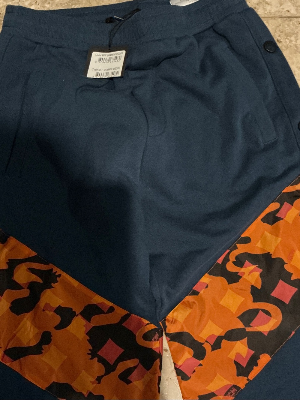 MCM Navy Blue Track Joggers with Orange Printed Panels snap sides, new